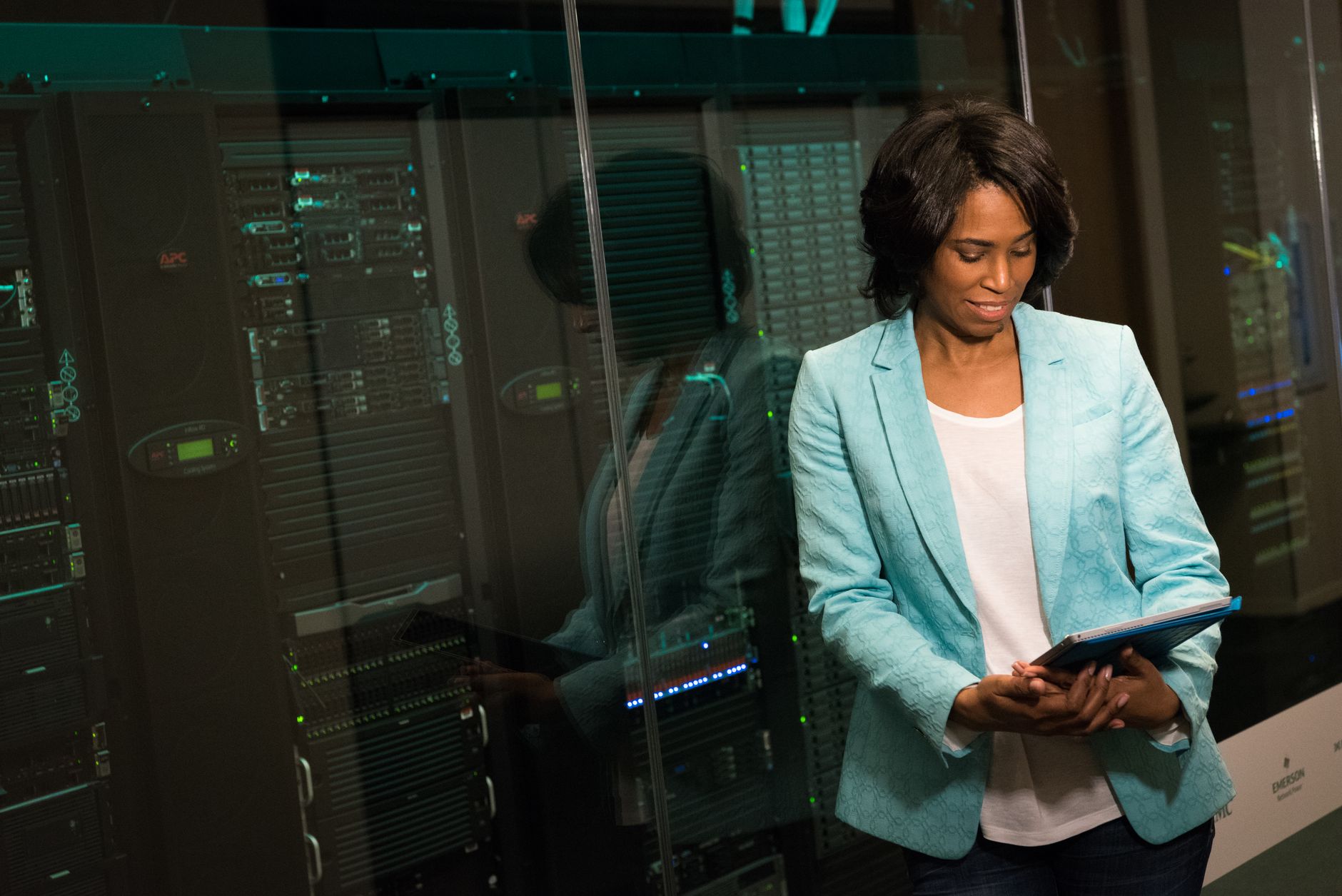 Senior female technology architecture developer reviewing server code