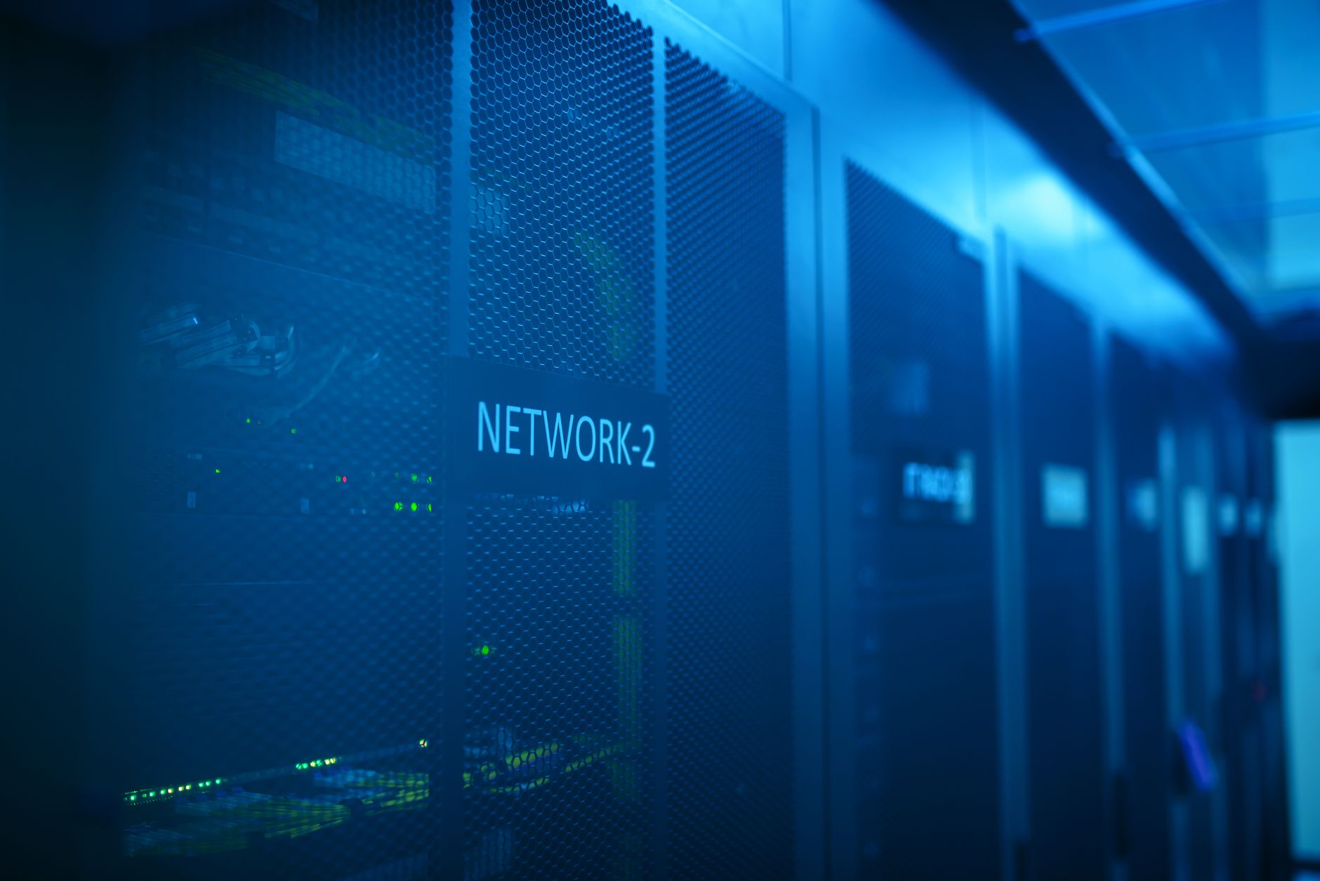 Enterprise technology hardware room with blue neon lighting systems